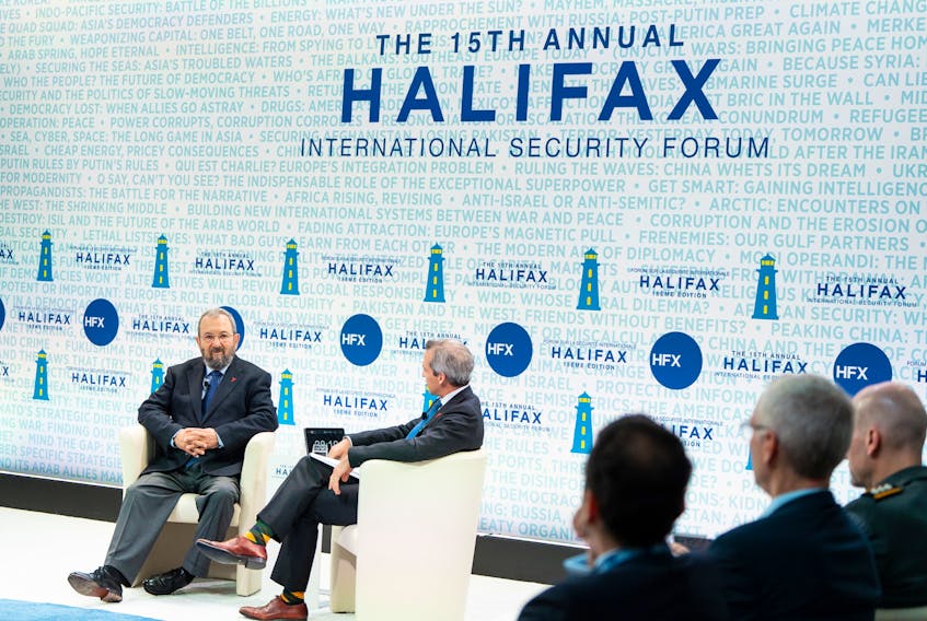 Ehud Barak, left, speaks with with PBS correspondent Nick Schifrin at the Halifax International Security Forum on Saturday morning.
