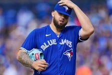 Alek Manoah of the Toronto Blue Jays reacts after hitting Taylor Ward of the Los Angeles Angels with a pitch during the fifth inning in their MLB game at the Rogers Centre on July 29, 2023 in Toronto.