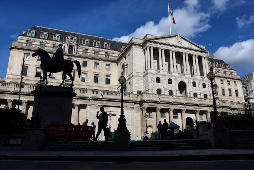 A pedestrian walks past the Bank of England in the City of London, Britain, September 25, 2023.