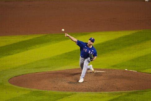 Nov 1, 2023; Phoenix, AZ, USA; Texas Rangers relief pitcher Josh Sborz (66) pitches in the eighth inning against the Arizona Diamondbacks in game five of the 2023 World Series at Chase Field. Mandatory Credit: Joe Camporeale-USA TODAY Sports