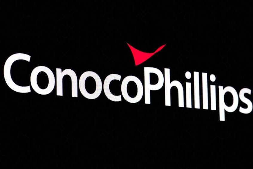 A screen displays the logo for ConocoPhillips on the floor of the New York Stock Exchange (NYSE) in New York City, U.S., April 6, 2022.