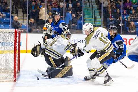 Charlottetown Islanders goaltender Jakob Robillard and defenceman Lane Hinkley, 19, track the puck during a Quebec Major Junior Hockey League game at Eastlink Centre in Charlottetown on March 24. Also following the play are the Sea Dogs’ Giuseppe Ianniello, 10, and Alexis Cournoyer, 92. The Islanders won the game 4-3 in overtime. Darrell Theriault • Charlottetown Islanders