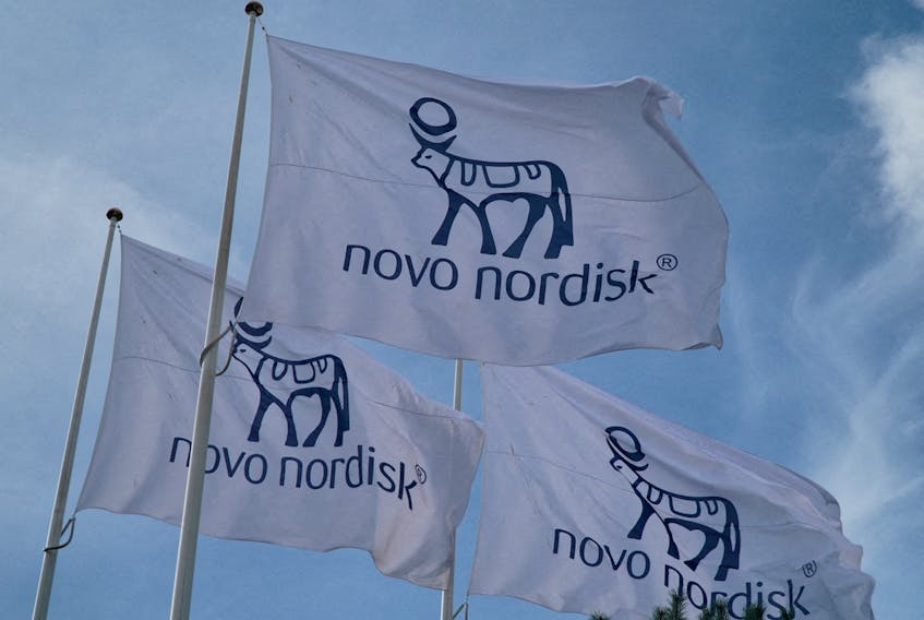 Flags with the Novo Nordisk logo flutter outside their Danish company's offices in Copenhagen, Denmark, September 26, 2023.
