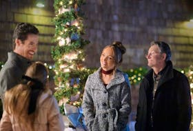 Ben Mehl (left) and Amber Marshall (centre) star in "My Christmas Guide," was to premiere on W Network Thursday night, Nov. 2, 2023. The TV movie was filmed in St. John's by Fireside Pictures and features several local actors. Photo courtesy of Hallmark.