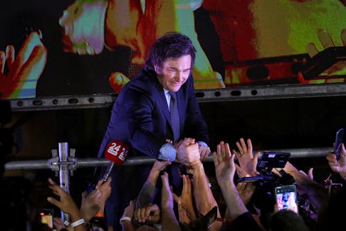 Argentine president-elect Javier Milei greets supporters after winning Argentina's runoff presidential election, in Buenos Aires, Argentina November 19, 2023.