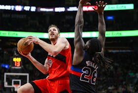 Toronto Raptors centre Jakob Poeltl (19) attacks the net while guarded by Detroit Pistons centre Isaiah Stewart (28) during second half NBA basketball action, in Toronto, Sunday, Nov. 19, 2023.  