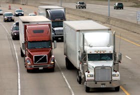 Two freight trucks are driven on the Fisher freeway in Detroit, Michigan, U.S. March 27, 2009.