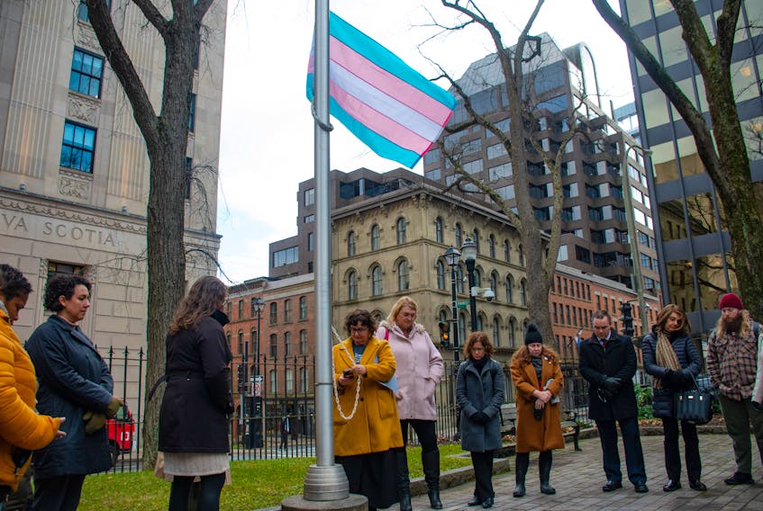 People observe a moment of silence as the Transgender Pride flag is raised outside Province House on Monday, Nov. 20, 2023.
Ryan Taplin - The Chronicle Herald