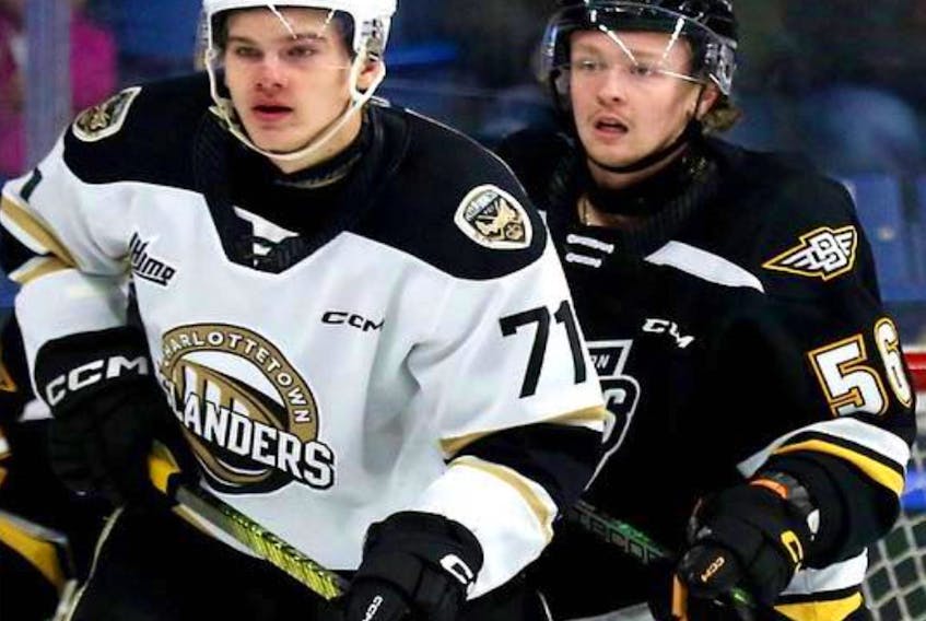 Charlottetown Islanders' Ondrej Maruna, left, fends off Cape Breton Eagles' Lincoln Waugh during Sunday's Quebec Major Junior Hockey League game at Centre 200, The Eagles would go on to shut down the Islanders 5-0. CONTRIBUTED