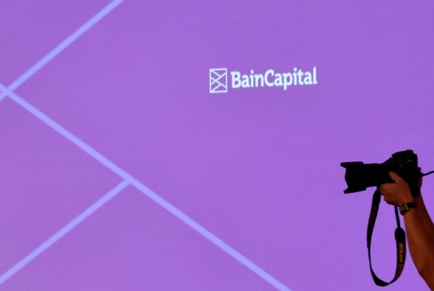 The logo of Bain Capital is displayed on the screen during a news conference in Tokyo, Japan October 5, 2017.