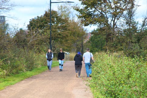 Walkers take a stroll along the Confederation Trail near UPEI on a fall afternoon.The province is looking into the viability of allowing ATVs to access parts of the former railbed. Guardian file