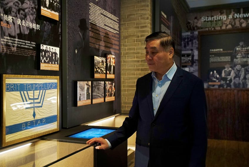Curator Chen Jian gives a tour of the exhibition for the camera at the Shanghai Jewish Refugee Museum in Shanghai, China November 17, 2023.
