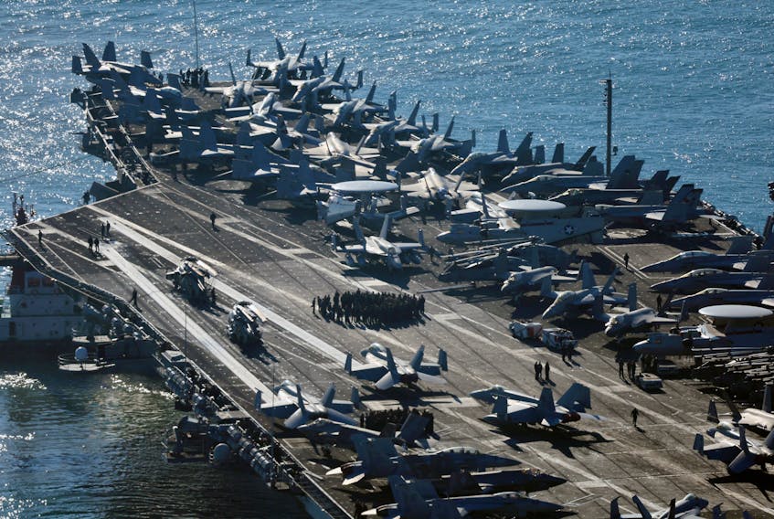 Fighter jets sit on the U.S. aircraft carrier USS Carl Vinson as it arrives at a port in Busan, South Korea, November 21, 2023.   Yonhap via REUTERS