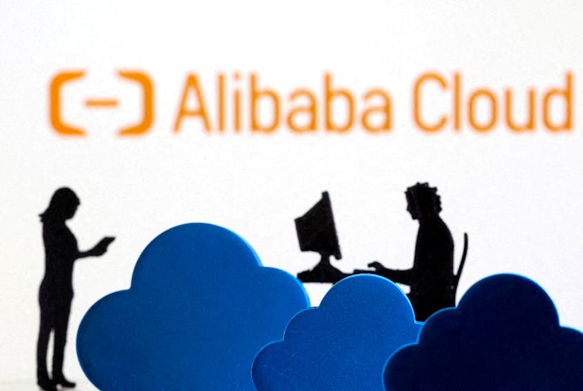 3D printed clouds and figurines are seen in front of the Alibaba Cloud service logo in this illustration taken February 8, 2022.