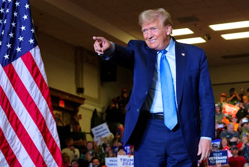 Republican presidential candidate and former U.S. President Donald Trump gestures during a campaign rally in Claremont, New Hampshire, U.S., November 11, 2023.