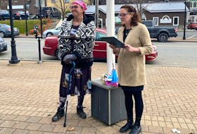 CBRM Mayor Amanda McDougall-Merrill, second from right, is shown reading the proclamation for Transgender Day of Remembrance on Nov. 20, prior to the flag raising. Beside her is Willow Ladouceur, far right.