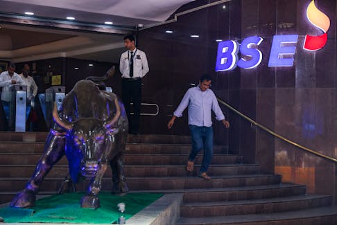 A man walks past the new logo of the Bombay Stock Exchange (BSE) building in Mumbai, India, July 12, 2023.