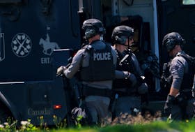 ERT members of both the Halifax Regional police and RCMP are seen n front of a Frederick Ave home in Fairview Thursday August 3, 2023. Police had released little information at this time.....

TIM KROCHAK PHOTO