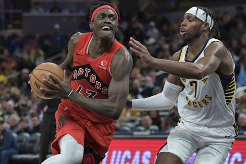 Toronto Raptors forward Pascal Siakam drives toward the basket against Indiana Pacers guard Buddy Hield (7) during the second half of an NBA basketball game Wednesday, Nov. 22, 2023, in Indianapolis.  