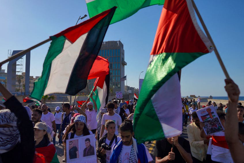 People march nearby the U.S. Embassy in support of Palestinians, calling for a ceasefire and for charging Israel with committing “genocide” in Gaza, in Havana, Cuba, November 23, 2023.
