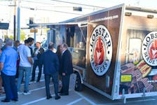 Customers gather around the Lobster Made Easy truck. The Mahone Bay-based company is enjoying plenty of success in Canada and beyond. CONTRIBUTED