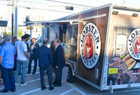 Customers gather around the Lobster Made Easy truck. The Mahone Bay-based company is enjoying plenty of success in Canada and beyond. CONTRIBUTED