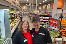 Lisa Lighfoot (left) is the new franchisee at the Independent grocery store in Kentville, Lightfoot, who took over from the retiring Jason Blanchard (right) started at the store in 1989 as a cashier. - Ian Fairclough