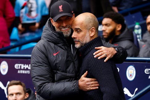 Soccer Football - Premier League - Manchester City v Liverpool - Etihad Stadium, Manchester, Britain - April 1, 2023  Manchester City manager Pep Guardiola with Liverpool manager Juergen Klopp before the match Action Images via Reuters/Jason Cairnduff/File Photo