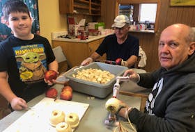 Jaxx Lavers (left), Peter MacKay and Wendell Heron were among 40 volunteers to pitch in to prepare 400 pies for a Durham Presbyterian Church Men’s Club fundraiser. Rosalie MacEachern