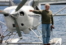 Glynn Williams ties up his float plane at a marina in Guysborough on Friday, August 15, 2008. (Peter Parsons/staff)