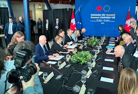 Delegates gather around a table at the Canada-EU Summit in St. John’s on Friday. -Juanita Mercer/SaltWire