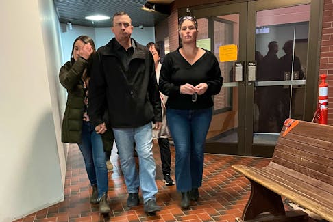 Darroll Murray Atwell, flanked by supporters, arrives at Kentville Supreme Court Nov. 24. He is awaiting sentencing on three charges relating to the disposal of his dead friend’s body back in May 2020.