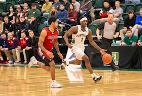 The UPEI Panthers’ Kamari Scott, 1, dribbles the ball up the court while the Acadia Axemen’s Demeric Mercer, 3, defends. The action took place during an Atlantic University Sport (AUS) Men’s Basketball Conference game at the Chi-Wan Young Sports Centre in Charlottetown on Nov. 25. UPEI won the game 76-60. Janessa Vanden Broek/UPEI Athletics • Special to The Guardian