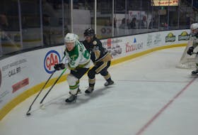 Charlottetown Islanders defenceman Simon Duguay, 24, defends against the Val-d’Or Foreurs’ Nathan Drapeau, 52, in a Quebec Major Junior Hockey League (QMJHL) game at Eastlink Centre in Charlottetown on Nov. 25. Val-d’Or won the game 3-2 in overtime. Jason Simmonds • The Guardian