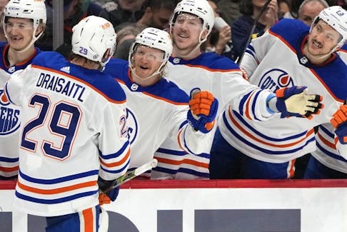 Edmonton Oilers center Leon Draisaitl (29) is congratulated by teammates after scoring in the second period of an NHL hockey game against the Washington Capitals on Friday, Nov. 24, 2023, in Washington.