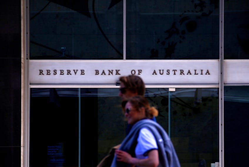 Pedestrians walk past the main entrance to the Reserve Bank of Australia building in central Sydney, Australia, October 3, 2016. 