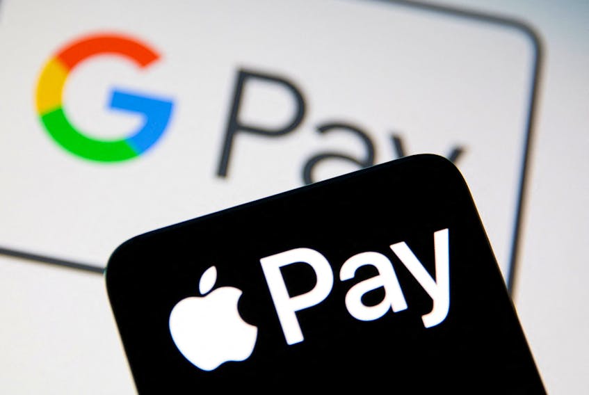 A smartphone with the Apple Pay logo is placed on a displayed Google Pay logo in this illustration taken on July 14, 2021.