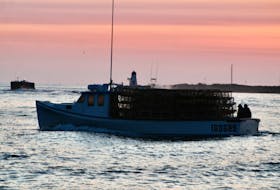 A boat loaded up with lobster traps leaves Murray Harbour April 26 for setting day, one of several dozen boats to sail out of the harbour throughout the morning. Guardian file