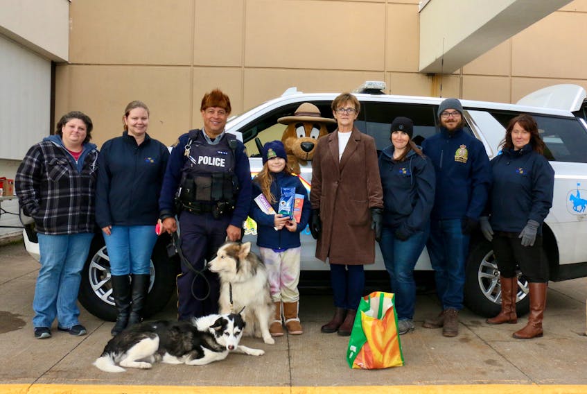 Members of the West Hants RCMP detachment, Victims Services, and Matthew 25 Windsor and District Food Bank took part in the RCMP’s annual Stuff a Cruiser event, which took place on Dec. 3 outside Sobeys in Windsor. The goal was to collect donations of food and funds to help the local food bank. Pictured are, from left, Ashley Hingley, Tamara Harvey, Const. Richard Collins with his dogs Karma and Ace, Abby Barker, Bonnie Cookson, Tracy Gregory, Andrew Barker and Michelle Peach.