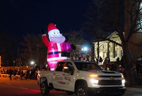 Ballooned Santa Claus kicked off the Charlottetown Christmas Parade with a joyride, waving to spectators on Grafton Street. Vivian Ulinwa/SaltWire