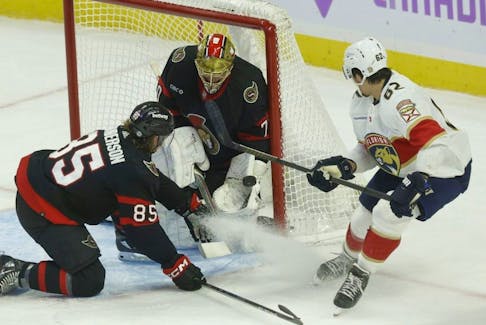 Ottawa Senators goaltender Joonas Korpisalo makes a glove save against the Florida Panthers during first period action at the Canadian Tire Centre in Ottawa on Nov. 27, 2023.

