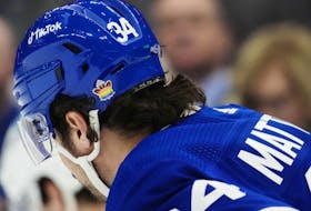 Toronto Maple Leafs' Auston Matthews (34) wears a pride-themed sticker on his helmet.