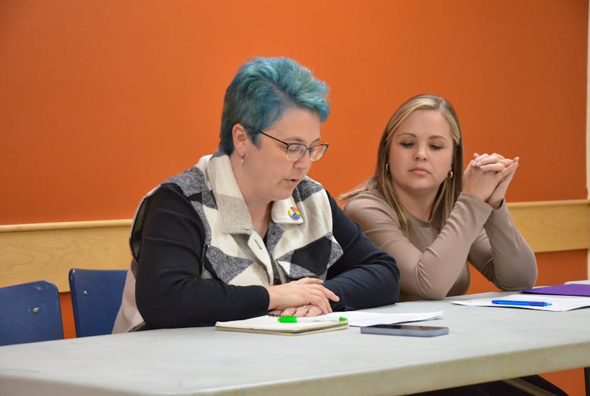 Annapolis Valley Apple Blossom Festival board member Stacey Vries gives a report on the leadership competition during the festival’s annual general meeting in New Minas on Nov. 20 as board member Vanessa Thurston looks on. KIRK STARRATT