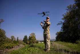 A Ukrainian border guard launches a drone he uses to survey the border to Romania, to look for people who cross illegally including men attempting to flee abroad to avoid military service, in Tyachiv, amid Russia's attack on Ukraine, September 26, 2023. 