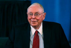 Berkshire Hathaway Vice Chairman Charlie Munger arrives to begin the company's annual meeting in Omaha May 4, 2013.