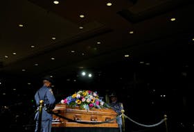 A Georgia State Patrol honor guard stands as members of the public pay respects to former first lady Rosalynn Carter at the Jimmy Carter Presidential Library and Museum, during the public repose, in Atlanta, Georgia, U.S., Nov. 27, 2023.     Brynn Anderson/Pool via REUTERS
