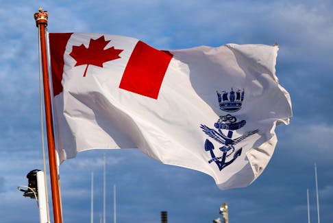 Canadian naval ensign is hoisted on the deck of the Royal Canadian Navy's Halifax-class frigate HMCS Calgary (FFH335) at the U.S. naval base in Yokosuka, Japan November 7, 2018. Picture taken November 7, 2018. 