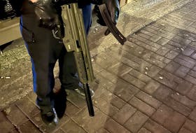 Dylan Callendar, 21, is charged with several weapons offences after he allegedly carried this semi-automatic firearm with a silencer and a magazine with four bullets on George Street earlier this month.
