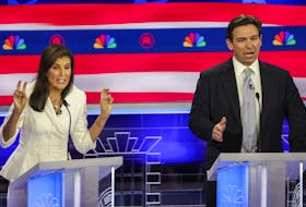 Former South Carolina Governor Nikki Haley and Florida Governor Ron DeSantis speak simultaneously at the third Republican candidates' U.S. presidential debate of the 2024 U.S. presidential campaign hosted by NBC News at the Adrienne Arsht Center for the Performing Arts in Miami, Florida, U.S., November 8, 2023.
