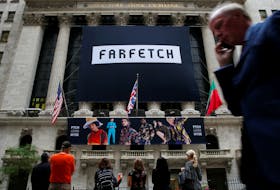 A banner to celebrate the IPO of online fashion house Farfetch is displayed on the facade of the of the New York Stock Exchange (NYSE) in New York, U.S., September 21, 2018.